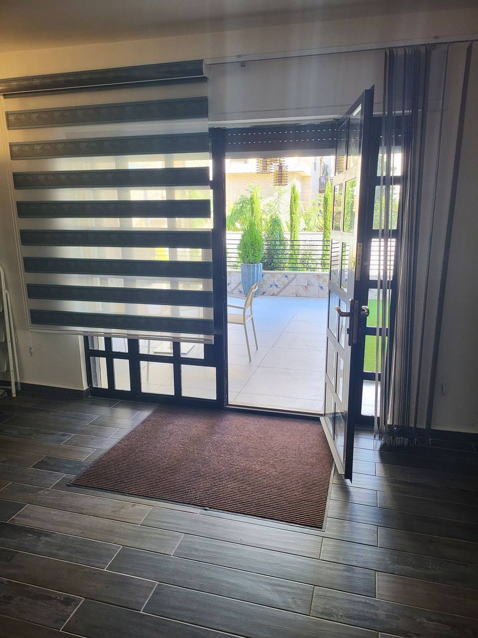 Indoor-outdoor flow — glazed access from living area to terrace