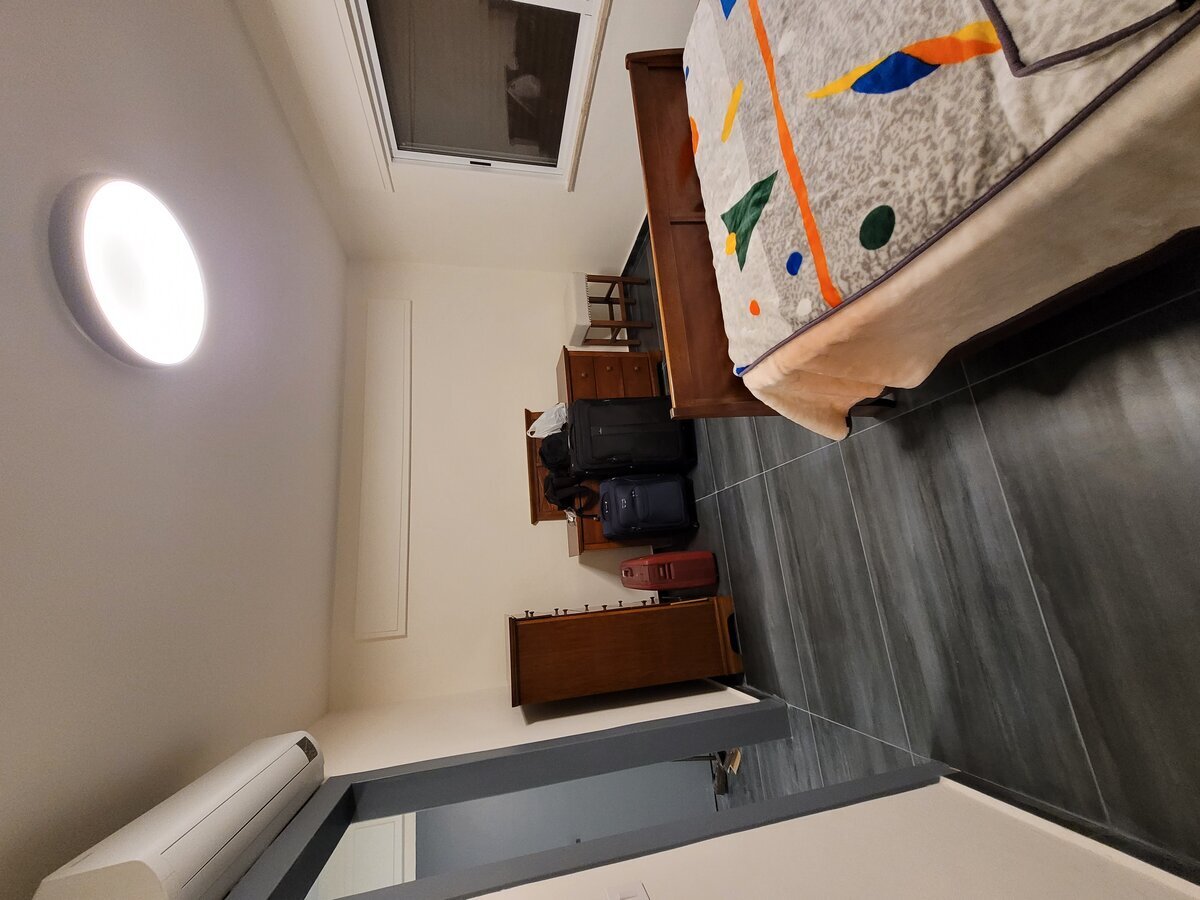 Master bedroom completed fit-out — bespoke joinery and engineered flooring