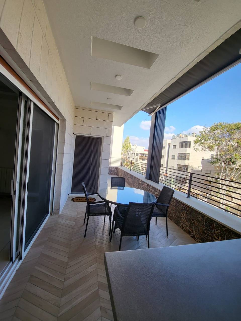 Upper-floor covered terrace — bespoke outdoor dining area