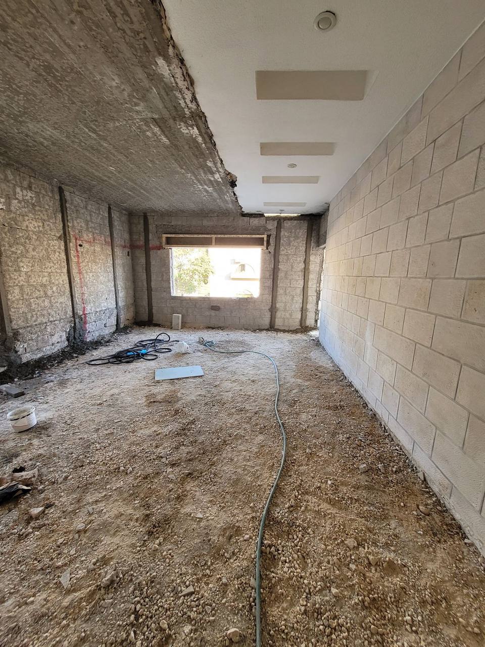 Terrace space during strip-out — bare concrete structure before fit-out
