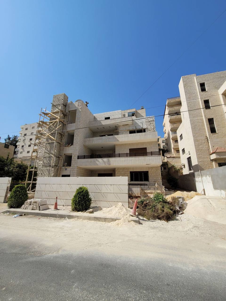 Exterior works — building with scaffolding during renovation phase
